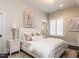 Inviting bedroom with tufted headboard, soft bedding, and natural light from shuttered window at 464 Rosemont Dr, Durham, NC 27713