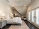 Bright bedroom with a ceiling fan, neutral tones, and private balcony access at 464 Rosemont Dr, Durham, NC 27713