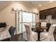 Dining area with wood table, white chairs, and view to hallway at 464 Rosemont Dr, Durham, NC 27713