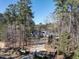 A beautiful single Gathering home with a long driveway, mature trees, and professionally landscaped yard at 464 Rosemont Dr, Durham, NC 27713