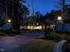 Stately home with a gated entrance and driveway illuminated by streetlights at 464 Rosemont Dr, Durham, NC 27713