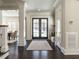 Elegant foyer featuring hardwood floors, grand columns, and stylish double doors leading to the exterior at 464 Rosemont Dr, Durham, NC 27713