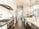Gourmet kitchen with stainless steel appliances, farmhouse sink, and dark hardwood floors at 464 Rosemont Dr, Durham, NC 27713