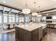 Open-concept kitchen with island, white countertops, and seamless transition to dining and living areas at 464 Rosemont Dr, Durham, NC 27713