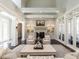 Elegant living room with fireplace, built-in cabinets, and plush seating at 464 Rosemont Dr, Durham, NC 27713