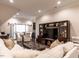 Open living area with comfortable seating, entertainment center, and adjacent dining space at 464 Rosemont Dr, Durham, NC 27713