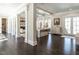Bright living room with dark hardwood floors, columns, and ample natural light at 464 Rosemont Dr, Durham, NC 27713