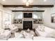 Cozy living room featuring a fireplace, built-in shelving, and wood beam ceilings at 464 Rosemont Dr, Durham, NC 27713