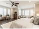 Serene main bedroom with sitting area, TV, and large windows with plantation shutters at 464 Rosemont Dr, Durham, NC 27713