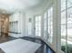 Bright mudroom featuring custom built-ins, with access to the outside and dark hardwood floors at 464 Rosemont Dr, Durham, NC 27713