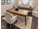 Bright office with wood desk, chairs, and natural light filtering through a window at 464 Rosemont Dr, Durham, NC 27713