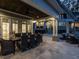 Covered outdoor dining area with seating for eight and access to the outdoor pool and lounge area at 464 Rosemont Dr, Durham, NC 27713