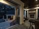 Covered outdoor living space with fireplace, lounge seating, and adjacent building at 464 Rosemont Dr, Durham, NC 27713