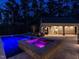 View of the pool and spa with purple lighting with lounge chairs by the pool at 464 Rosemont Dr, Durham, NC 27713