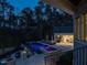 View of the pool and spa, lounge chairs, and adjacent building with doors at 464 Rosemont Dr, Durham, NC 27713