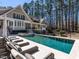 An inviting swimming pool with lounge chairs and outdoor hot tub situated near trees at 464 Rosemont Dr, Durham, NC 27713
