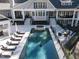 Expansive home exterior with multiple stairs, a pool, hot tub, and lounge chairs surrounding the pool at 464 Rosemont Dr, Durham, NC 27713