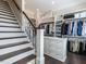 Spacious walk-in closet with custom shelving and a center island dresser for accessories at 464 Rosemont Dr, Durham, NC 27713