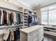 Walk-in closet featuring custom shelving and drawers for optimal storage space at 464 Rosemont Dr, Durham, NC 27713