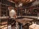 Extensive wine cellar with wooden racks, a ladder, and a table for tastings and display of wine collection at 464 Rosemont Dr, Durham, NC 27713