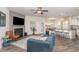Spacious living room featuring an open floorplan, fireplace, and modern finishes at 49 Parkside Dr, Lillington, NC 27546