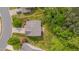 Overhead view of the house surrounded by lush greenery, showcasing a well-maintained lawn and mature trees at 504 Applecross Dr, Mebane, NC 27302