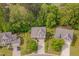Aerial view of home showcasing the manicured front yard, complemented by mature trees and a driveway at 504 Applecross Dr, Mebane, NC 27302