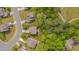 Aerial view of property amidst mature trees, surrounded by well-maintained lawns in a residential neighborhood at 504 Applecross Dr, Mebane, NC 27302