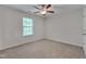 Bedroom features neutral carpet, light walls, a ceiling fan, and a window at 504 Applecross Dr, Mebane, NC 27302