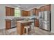 Kitchen features stainless appliances, granite counters, and a central island at 504 Applecross Dr, Mebane, NC 27302