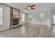 Spacious living room with modern ceiling fan and stone fireplace at 504 Applecross Dr, Mebane, NC 27302