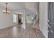 Bright living room featuring vinyl plank flooring, fireplace, and open to the dining room at 504 Applecross Dr, Mebane, NC 27302