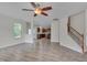Open floor plan featuring living room, staircase, and access to kitchen at 504 Applecross Dr, Mebane, NC 27302