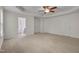 Spacious main bedroom featuring a tray ceiling, fan, and a walk-in closet at 504 Applecross Dr, Mebane, NC 27302