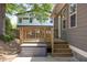 Relax on the back porch with the outdoor string lights creating a pleasant outdoor living space at 507 Canal St, Durham, NC 27701