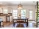 Bright dining area with wood floors, bench seating and stylish light fixture at 507 Canal St, Durham, NC 27701