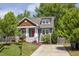 Charming home with a red door, beautiful landscaping, and a well-maintained lawn at 507 Canal St, Durham, NC 27701