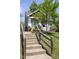 Charming home with a welcoming front porch, landscaped garden, and stone staircase leading to the entrance at 507 Canal St, Durham, NC 27701