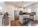 Bright kitchen featuring stainless steel appliances, a kitchen island and white cabinetry at 507 Canal St, Durham, NC 27701