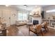 Inviting living room with a fireplace, comfortable seating, and elegant hardwood floors at 507 Canal St, Durham, NC 27701