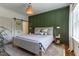 Cozy main bedroom with board and batten accent wall and modern lighting at 507 Canal St, Durham, NC 27701