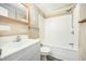 This bathroom features a shower-tub combo and a large vanity at 510 May St, Gibsonville, NC 27249