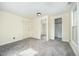 Bedroom with plush gray carpeting and closet at 510 May St, Gibsonville, NC 27249