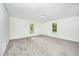 Well lit bedroom featuring plush carpet and freshly painted walls at 510 May St, Gibsonville, NC 27249