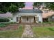 Charming home featuring a covered front porch with decorative wood railing at 510 May St, Gibsonville, NC 27249