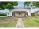 Charming home featuring a covered front porch with decorative wood railing at 510 May St, Gibsonville, NC 27249