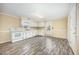 Spacious kitchen featuring white cabinetry and a modern vinyl floor at 510 May St, Gibsonville, NC 27249