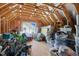 Unfinished attic with wood framing, a window, and ample storage space at 5172 Copain Cove, Fuquay Varina, NC 27526