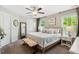 Serene bedroom with neutral tones, plush carpet, and ample natural light from windows at 5172 Copain Cove, Fuquay Varina, NC 27526