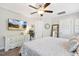 Spacious bedroom featuring a decorative dresser, tv, and neutral décor for a relaxing ambiance at 5172 Copain Cove, Fuquay Varina, NC 27526